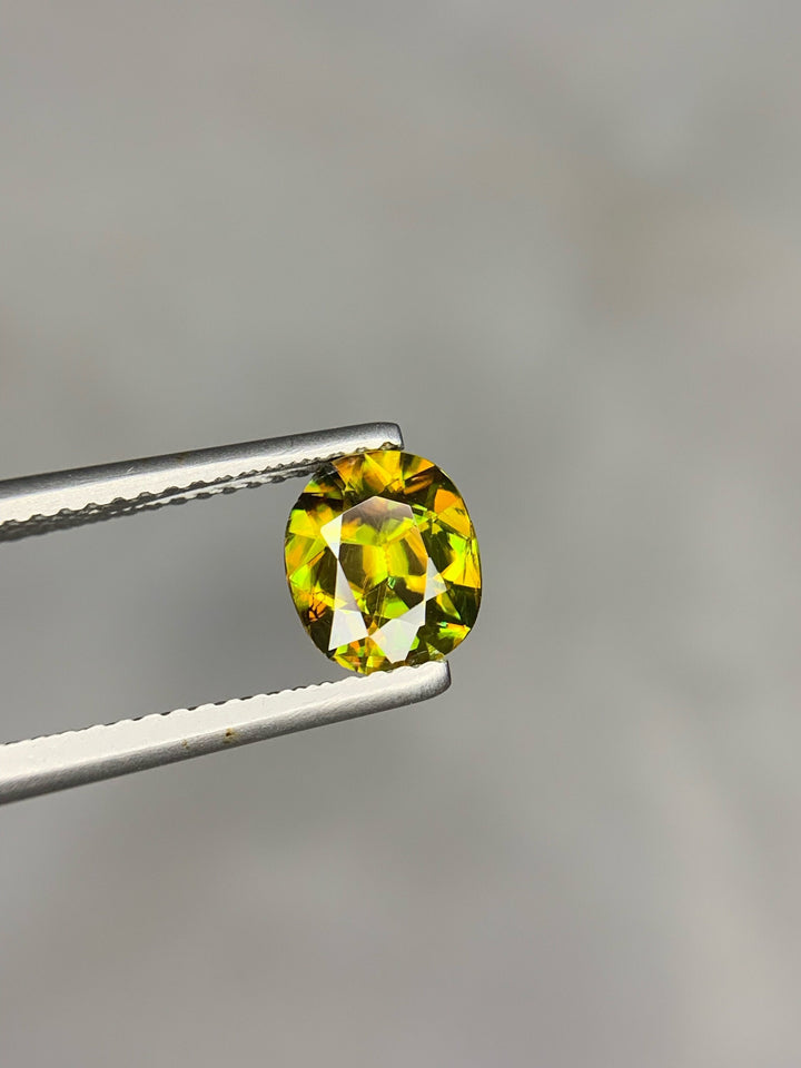 1.50 CT Natural Sphene Gemstone: Oval Cut, Himalayan Origin