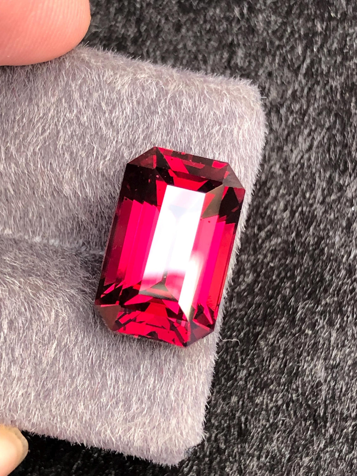 Red Rhodolite Garnet Emerald Cut 10.23 ct from Tanga Mine Tanzania