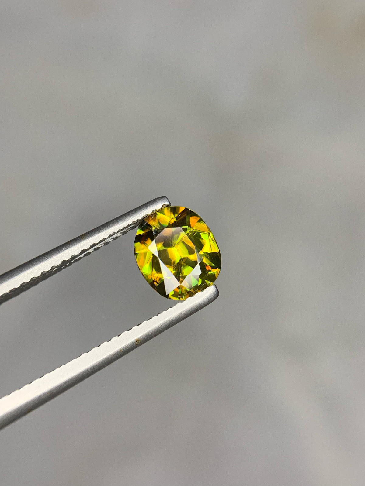 1.50 CT Natural Sphene Gemstone: Oval Cut, Himalayan Origin