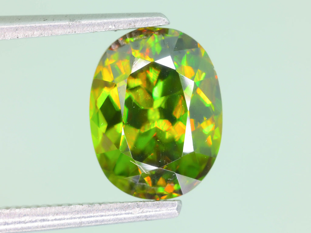 Chrome Sphene Gemstone: 1.55 Carat Faceted Oval, African Origin