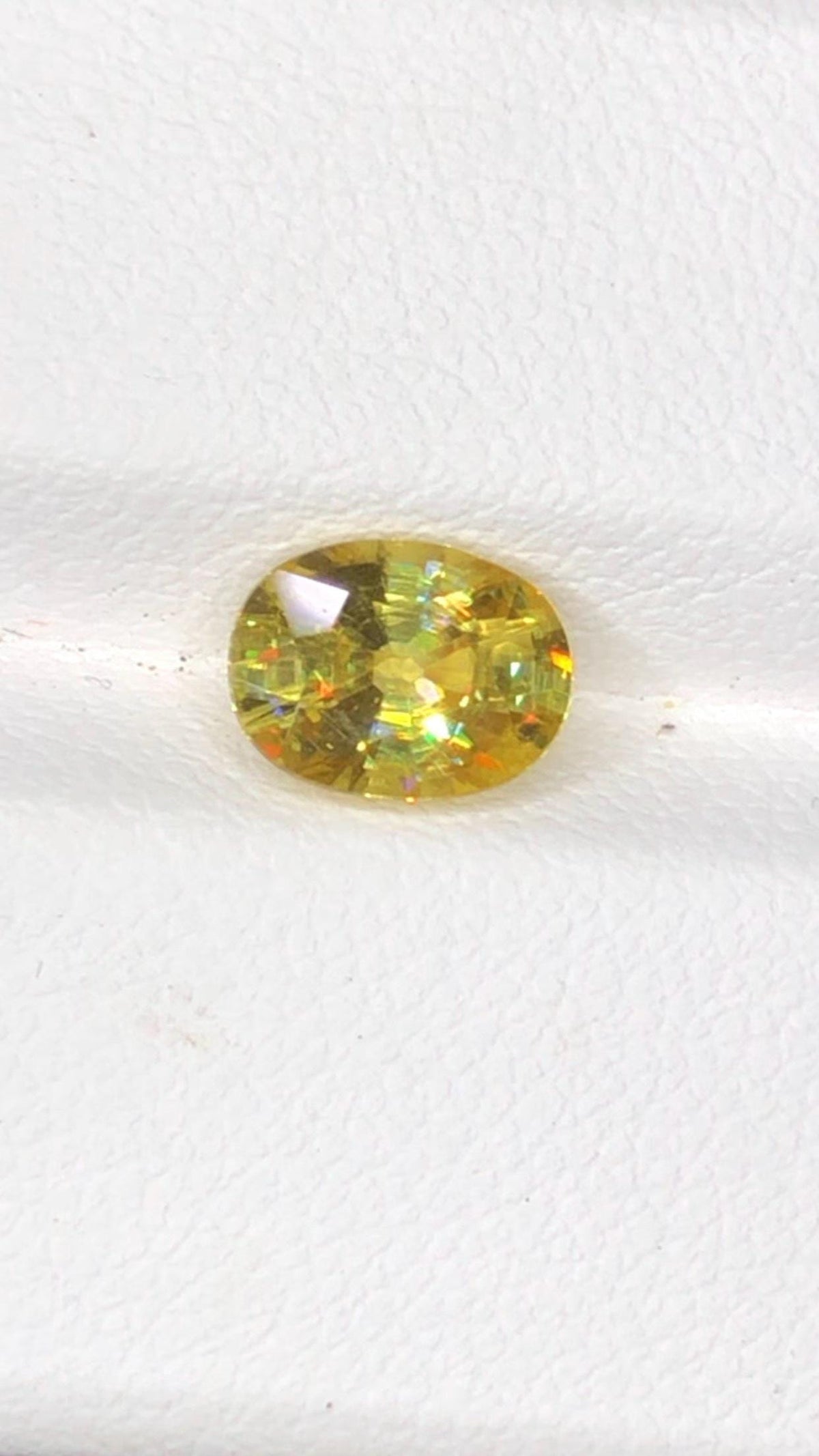 Natural Fire Sphene Gemstone: Oval Cut, 1.45 CT, Himalayan Origin