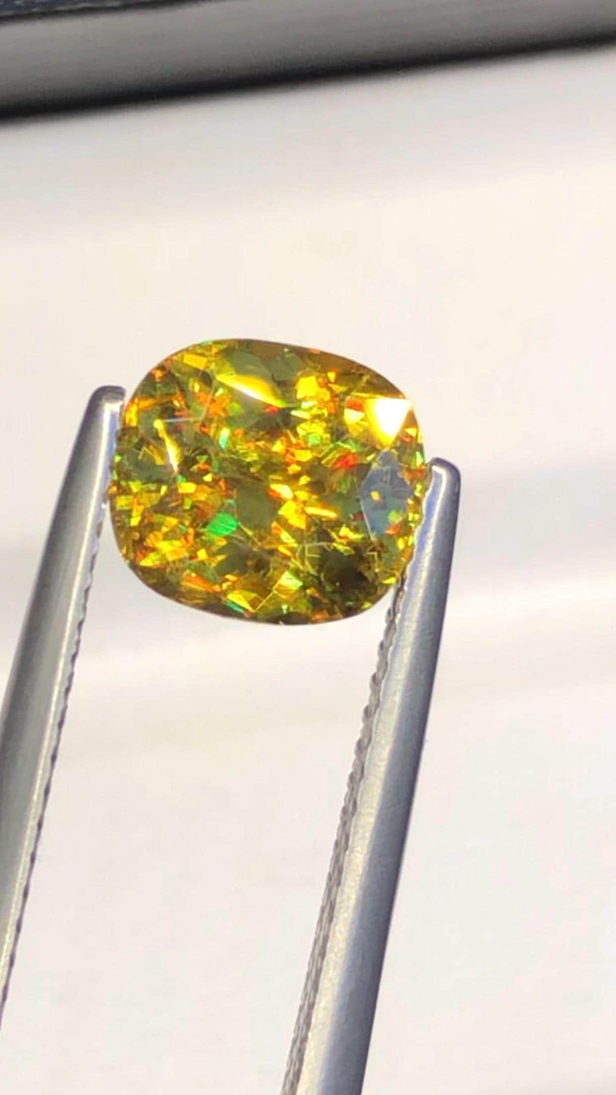 2.05 CT Cushion Cut Sphene Gemstone: Yellow-Red Trichroism